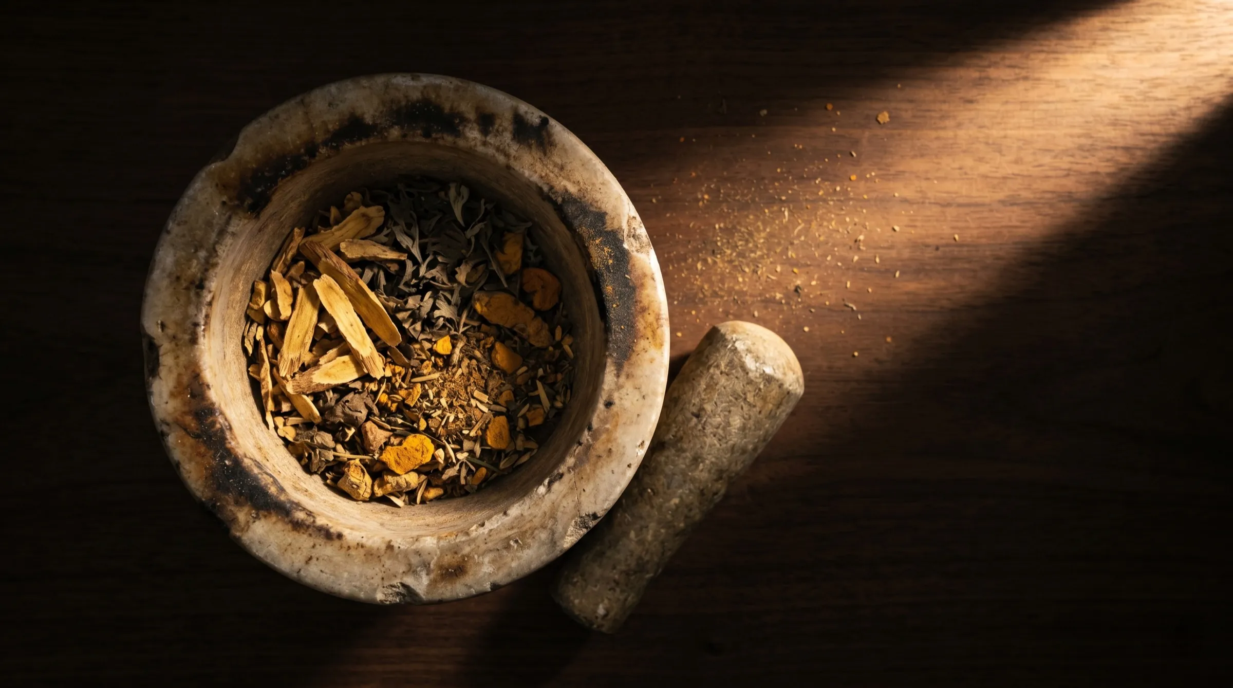 Dried herbs in a stone mortar